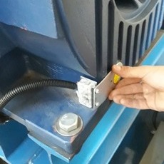 Low angle view up into a sky filled with deep blue clouds. 